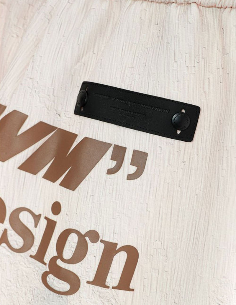 Pantalón MWM con Estampado Beige Unisex