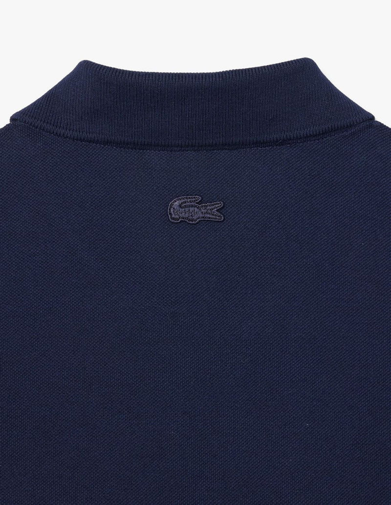 Polo Lacoste con Insignia de Corte Clásico L.12.12 Azul Marino Hombre