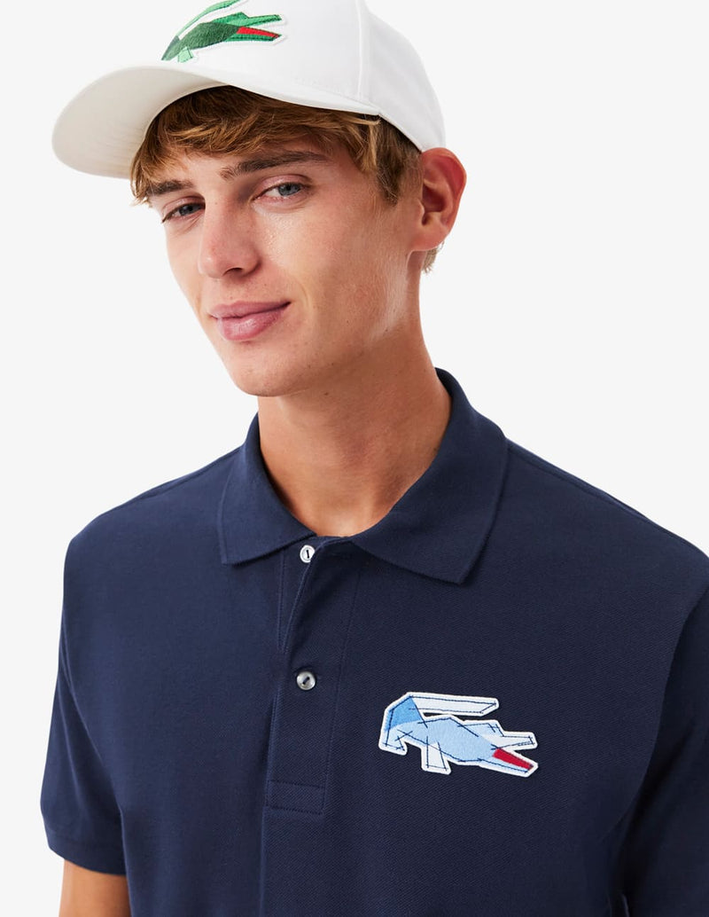 Polo Lacoste con Insignia de Corte Clásico L.12.12 Azul Marino Hombre