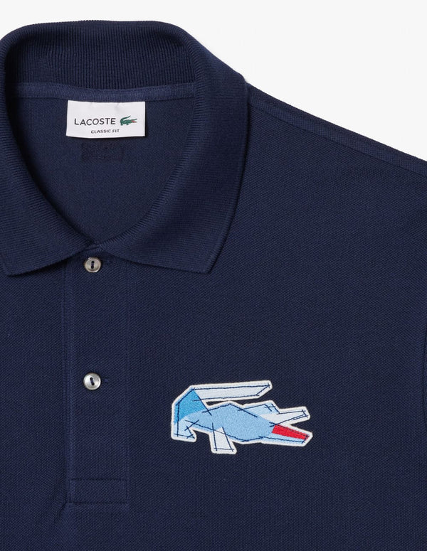 Polo Lacoste con Insignia de Corte Clásico L.12.12 Azul Marino Hombre